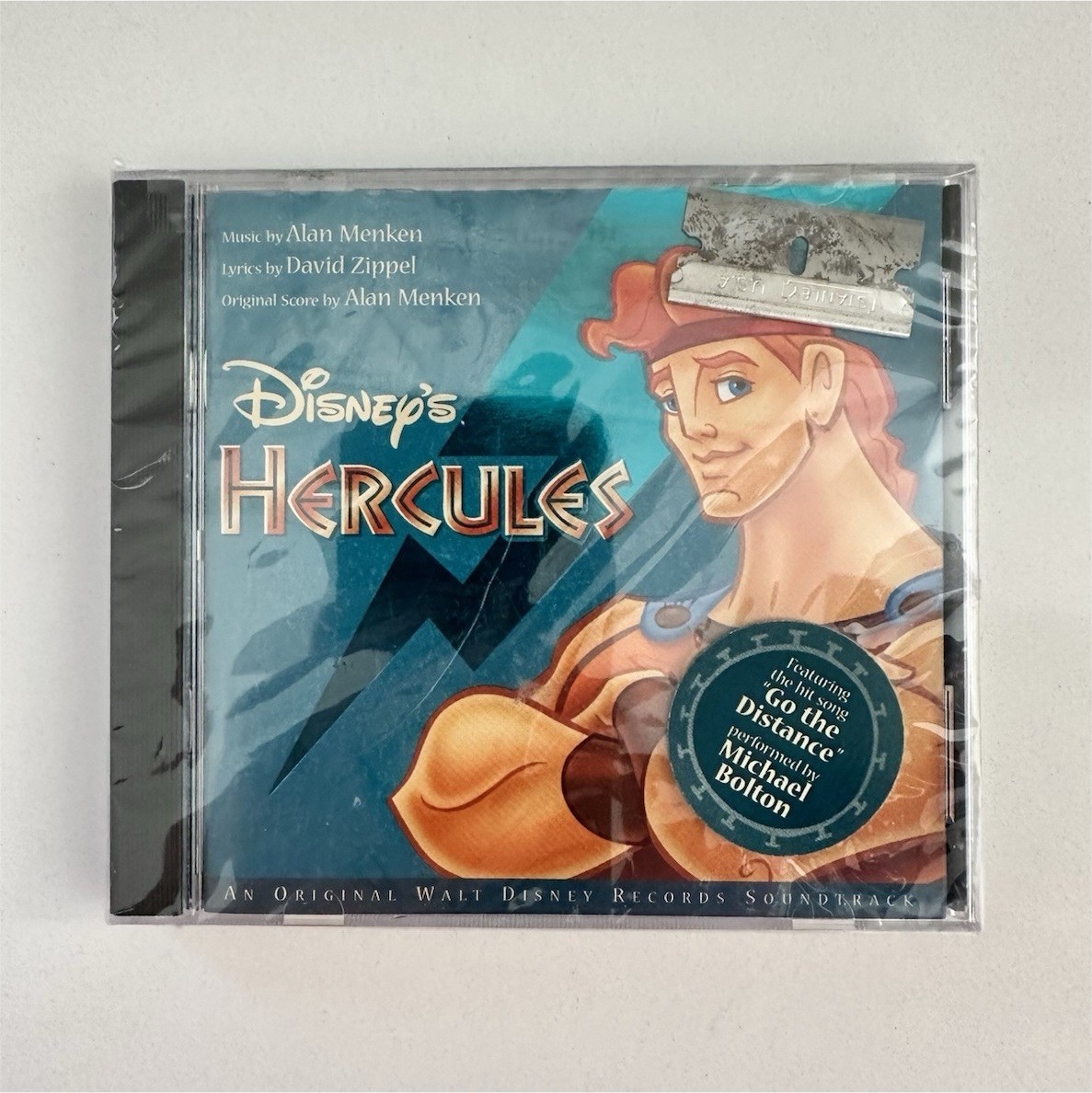 Sealed 1997 Disney Hercules CD-factory error-razor blade inside-rare contaminant