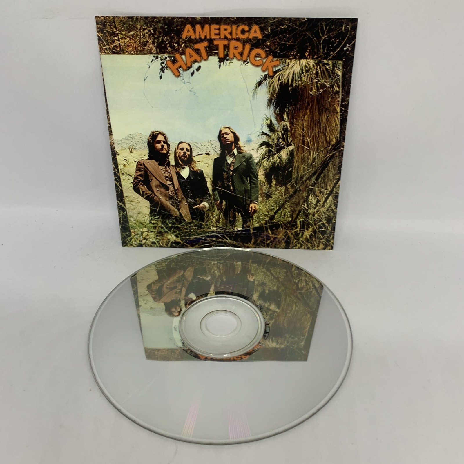America HAT TRICK CD Album ACCEPTABLE CONDITION Free Postage