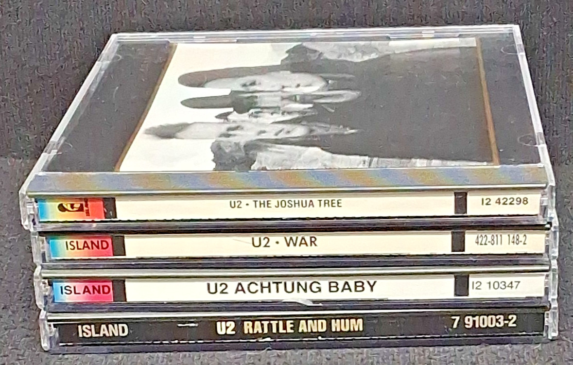 U2 Lot of 4 CDs. Alternate Rock - Rattle and Hum, Acting Baby, War Joshua Tree