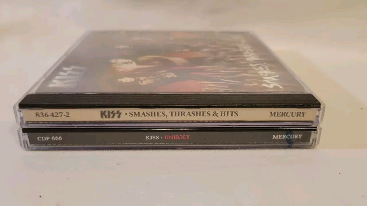 Kiss CD Lot - Smashes, Thrashes & Hits (836 427-2) and Unholy Promo CD (CDP 666)