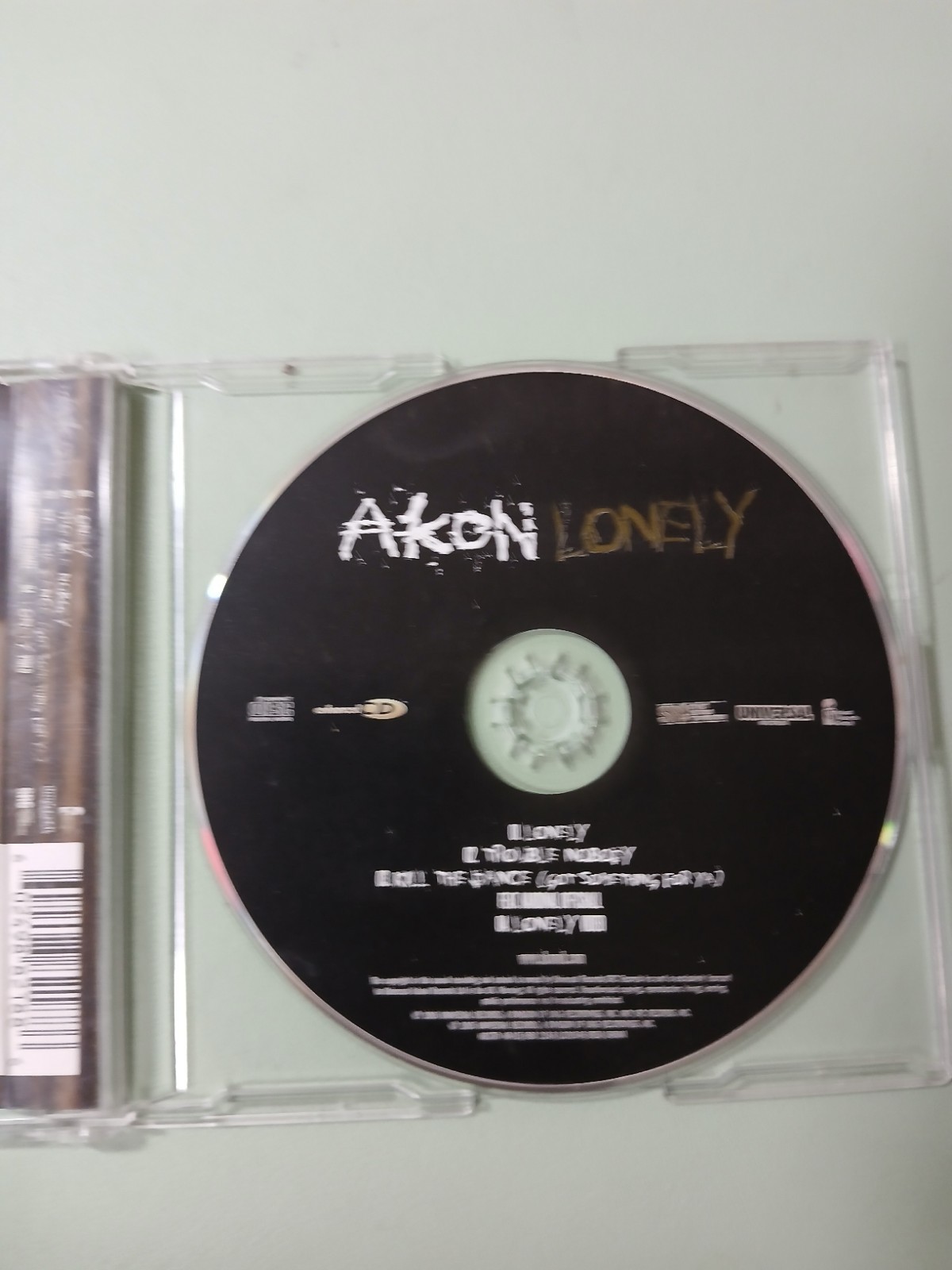 Akon "Lonely" CD single (2005), feat: Kardinal Offishall (cracked Case)