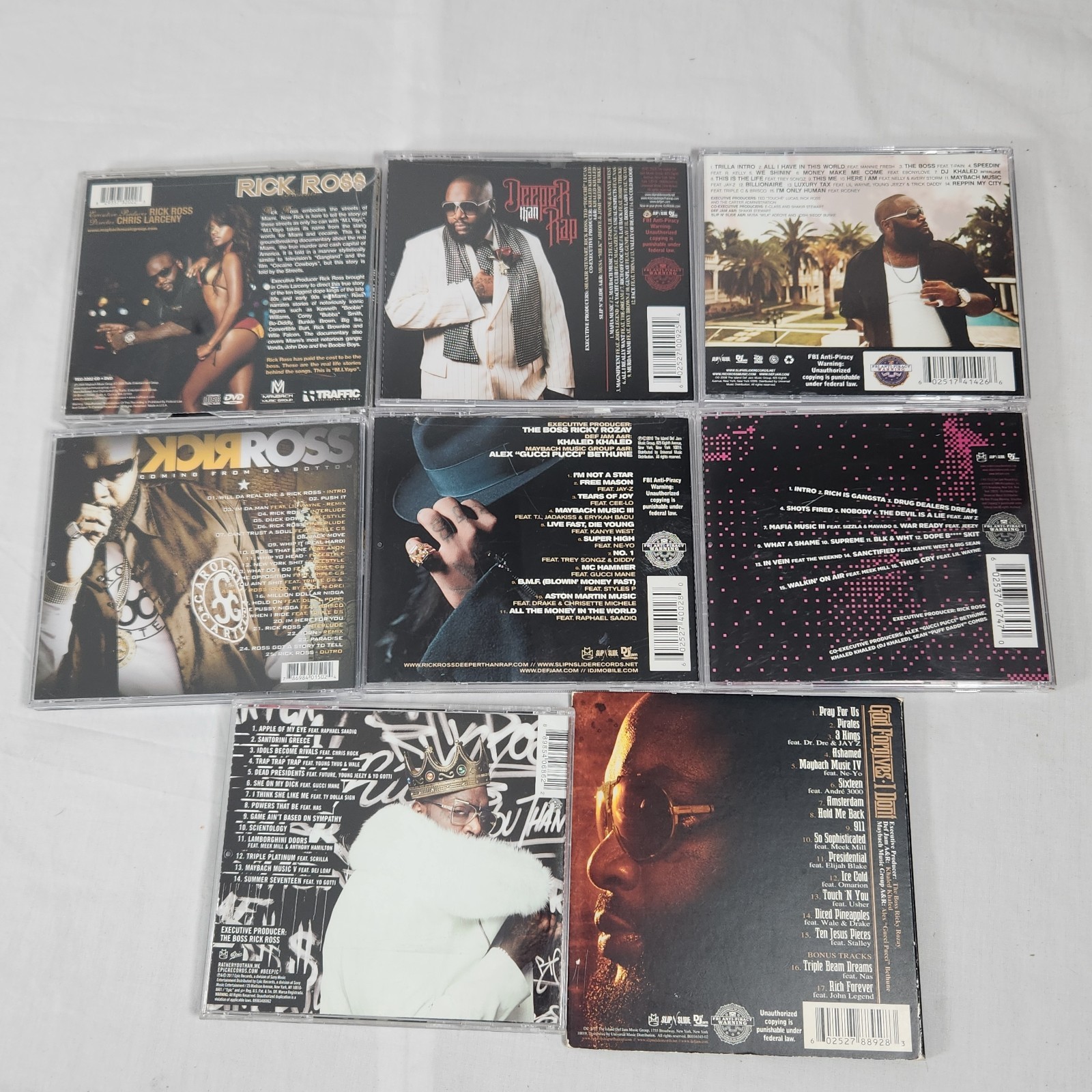 Mixed Lot Of 8 Rick Ross CDs In Cases
