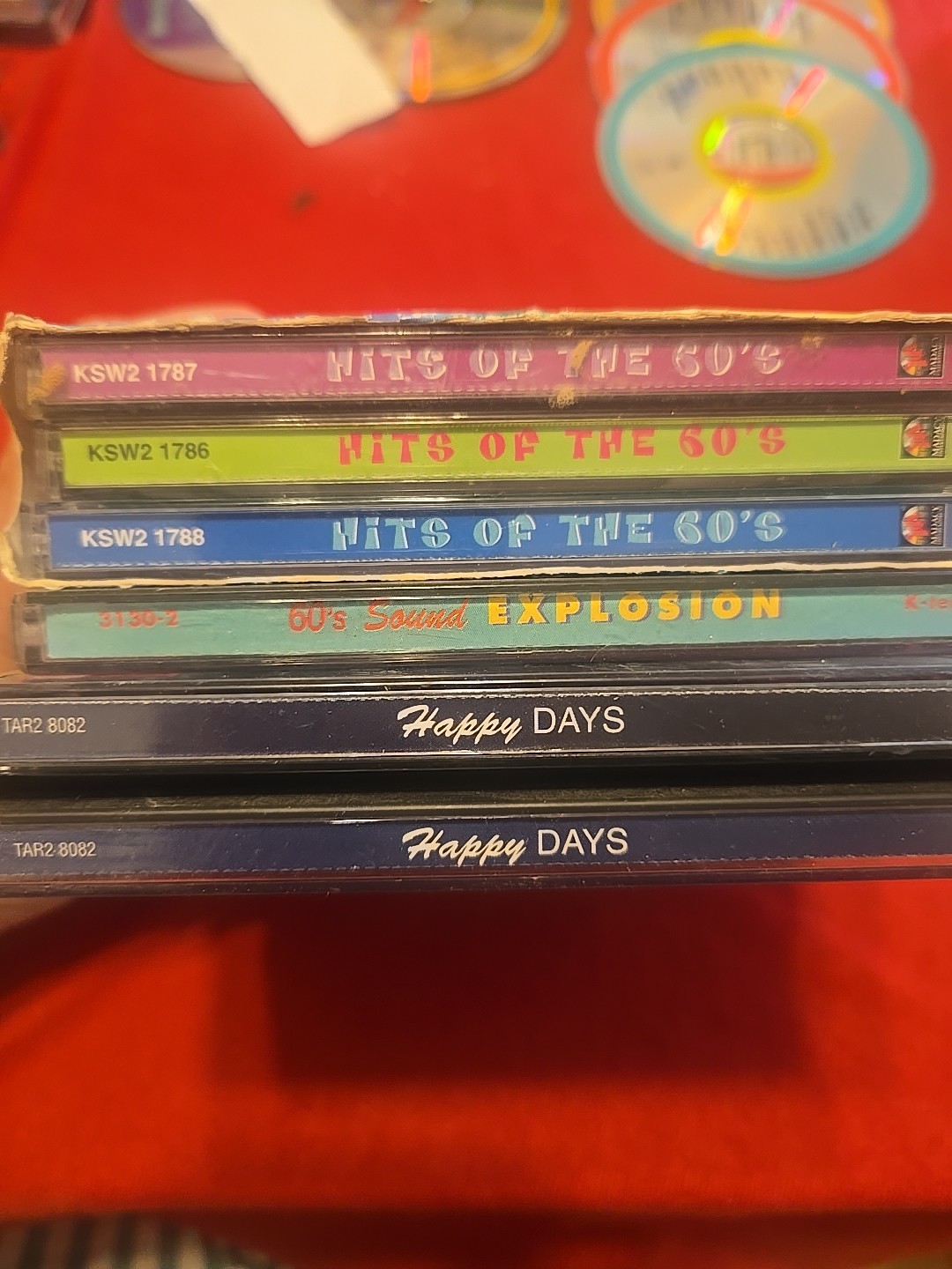 7 Music Cds: Hits of the 60's x3, Happy Days 1960s x3, 60s Sound Explosion.