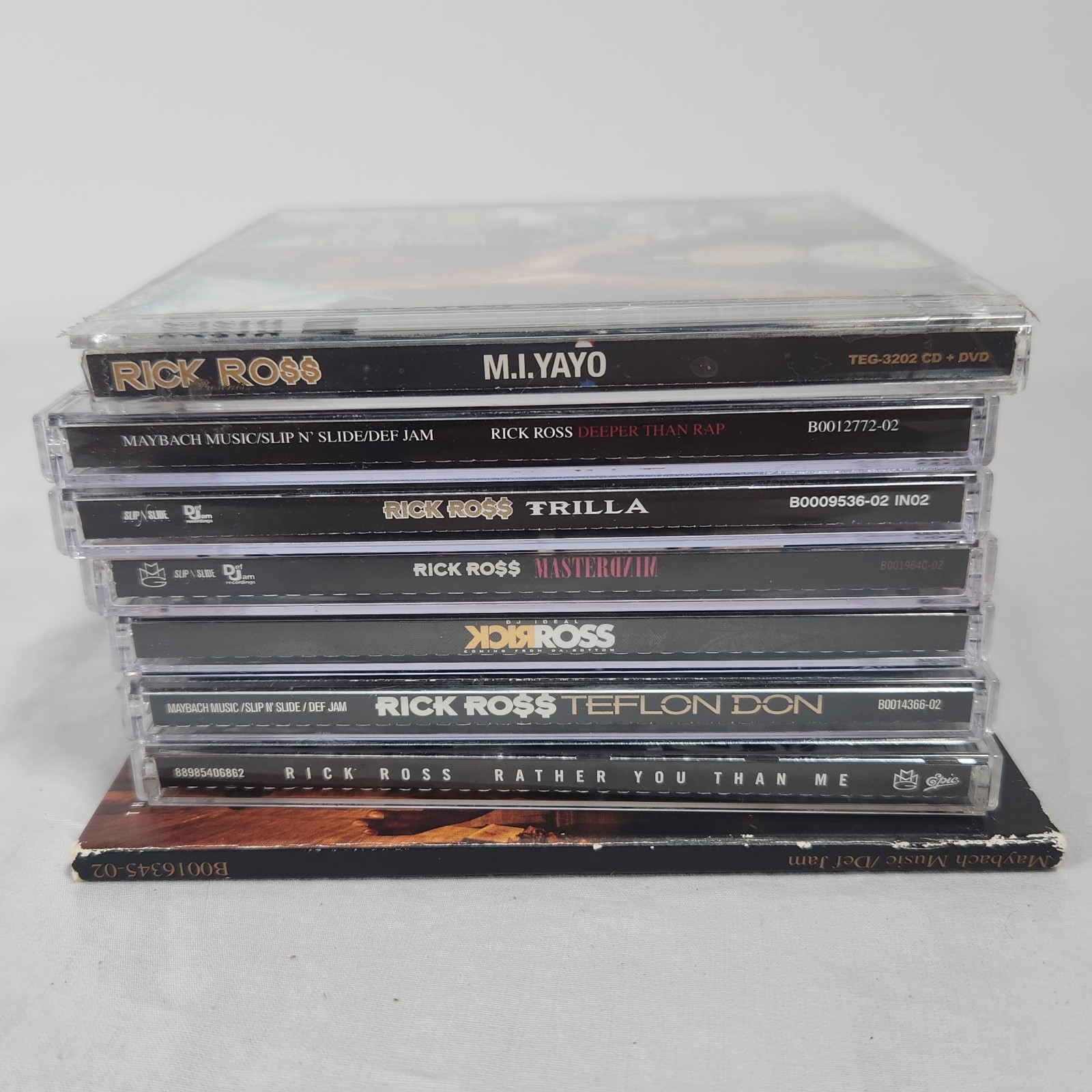 Mixed Lot Of 8 Rick Ross CDs In Cases