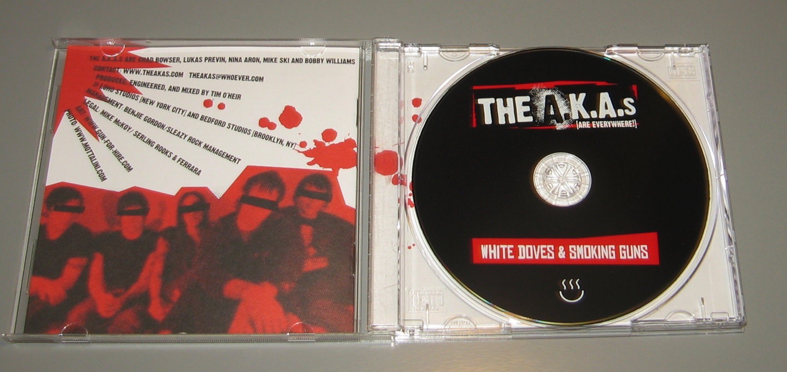 The A.K.A.s (Are Everywhere) - White Doves & Smoking Guns (CD, Fueled By Ramen)