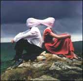 Casually Dressed & Deep In Conversation